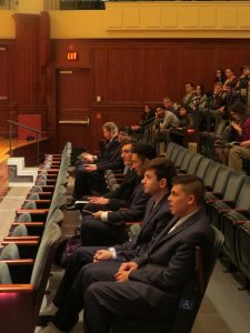 Group of people waiting in the audience to go present their business plan